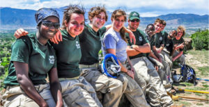 Mile High Youth Corps group shot on a mountain overlook